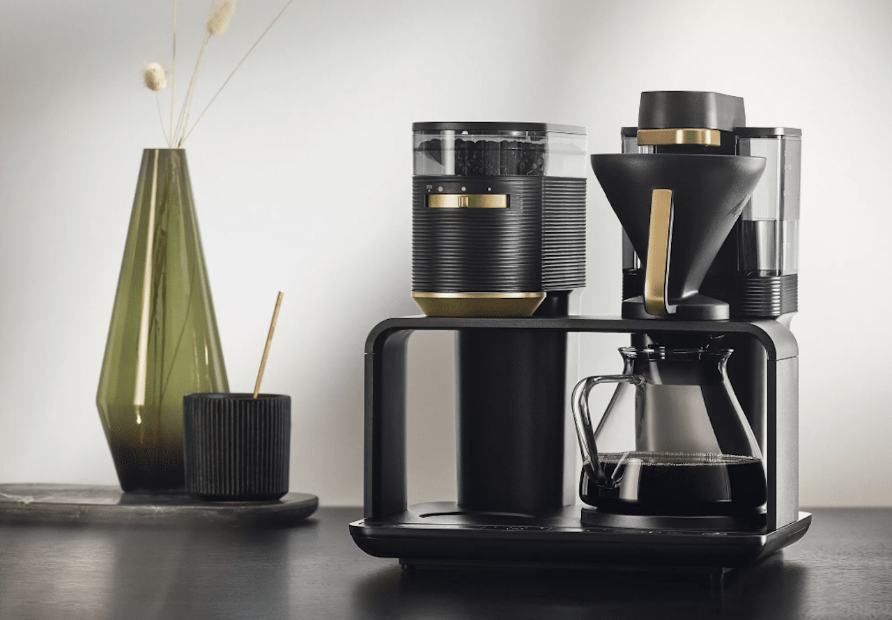 Une cafetière filtre avec broyeur intégré de la marque Melitta.