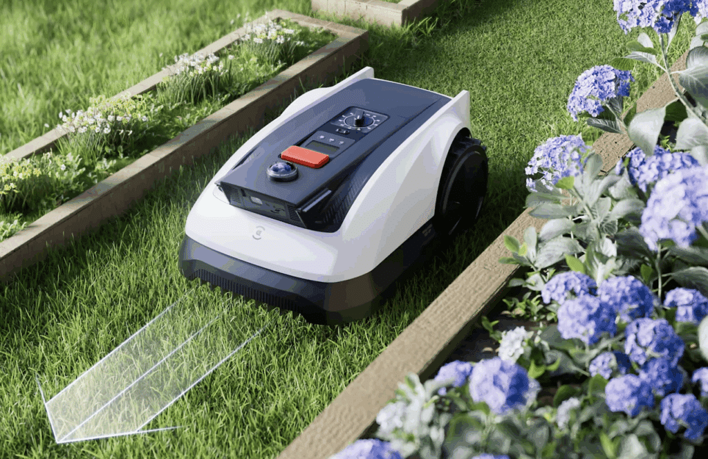 Un robot tondeuse de la marque Ecovacs dans un jardin.